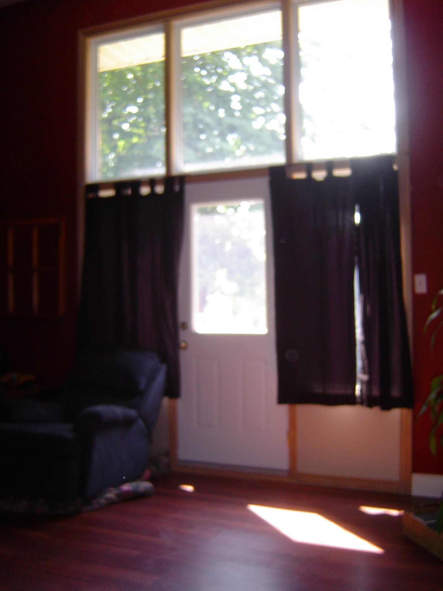 Doors to deck & treed yard off living room